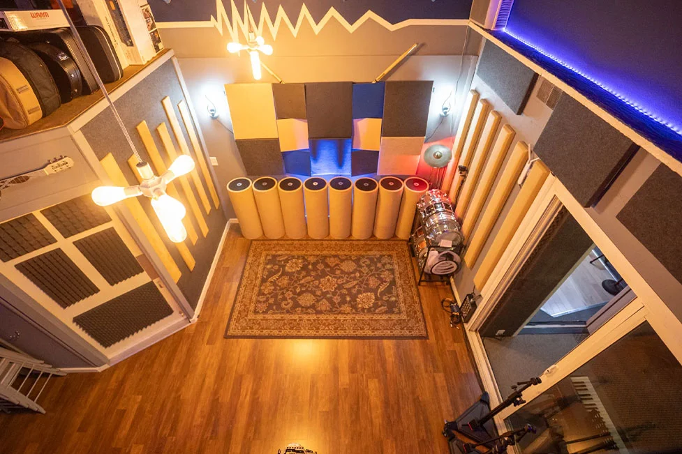 Bird’s eye view of Somni Studios live room with 25 foot slanted ceilings, acoustic panels, and drum setup for recording sessions