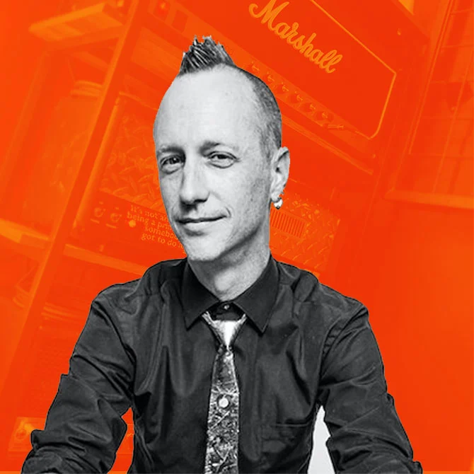 Matthew Fletcher recording and mixing engineer at Somni Studios on orange background portrait