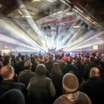 Concert crowd watching live performance with stage lighting in Bend Oregon