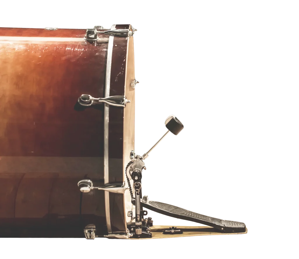 Close-up of a bass drum with pedal in the background of the SOMNI Studios services section