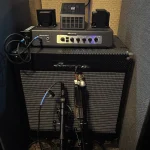 Ampeg bass amplifier with microphones positioned for recording at Somni Studios.