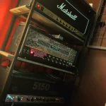 Marshall amp stack with Mesa Boogie and Peavey amps in Somni Studios live room.
