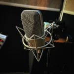 Close-up of professional condenser microphone at Somni Studios.