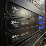 MOTU AVB 16A, 24Ai, and 24Ao audio interfaces in Somni Studios rack.