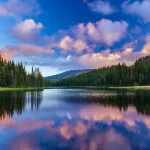 Mt. Bachelor reflected in the calm waters of Todd Lake near Bend Oregon at sunset