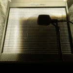 Close-miked Ampeg cabinet in Somni Studios isolation booth for detailed sound capture.