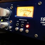 dbx 160SL compressor limiter VU meter glowing during mixing session at Somni Studios.