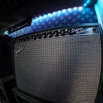Fender Deluxe Reverb amplifier under LED lighting in Somni Studios.