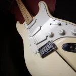 Fender Stratocaster electric guitar in vintage white finish at Somni Studios.