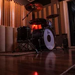 Gretsch drum set under warm studio lighting in the Somni Studios Live Room.
