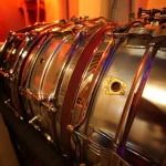 Collection of Ludwig Supraphonic snare drums on rack at Somni Studios.