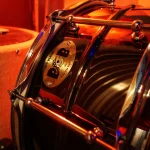 Pork Pie “Big Black” snare drum with chrome finish under studio lighting at Somni Studios.