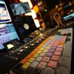 Pro Tools shortcut keyboard and mixing console in the Somni Studios control room.