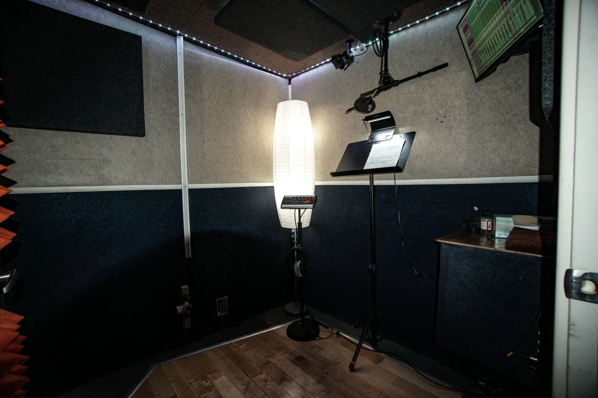 Voice-over booth at Somni Studios with pop filter and lighting setup.