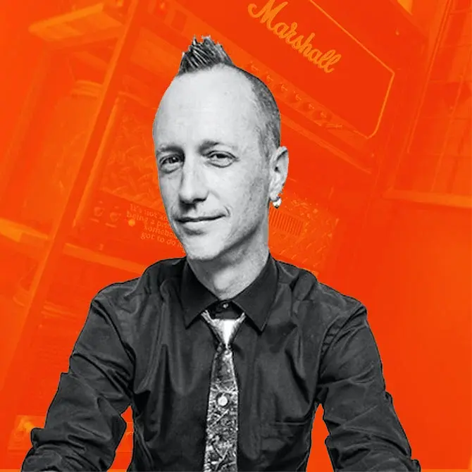 Matthew Fletcher recording and mixing engineer at Somni Studios on an orange background portrait